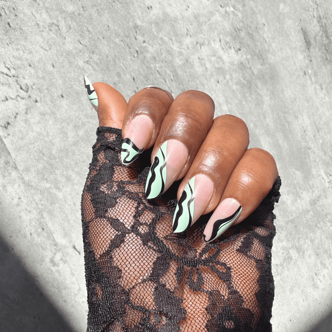 Close-up of Jade press-on nails with chic pattern