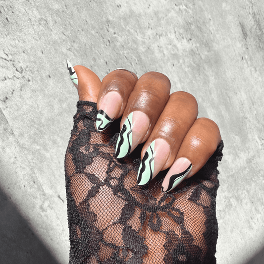 Close-up of Jade press-on nails with chic pattern