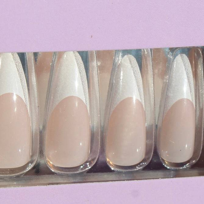 Close-up of French tips press-on nails set