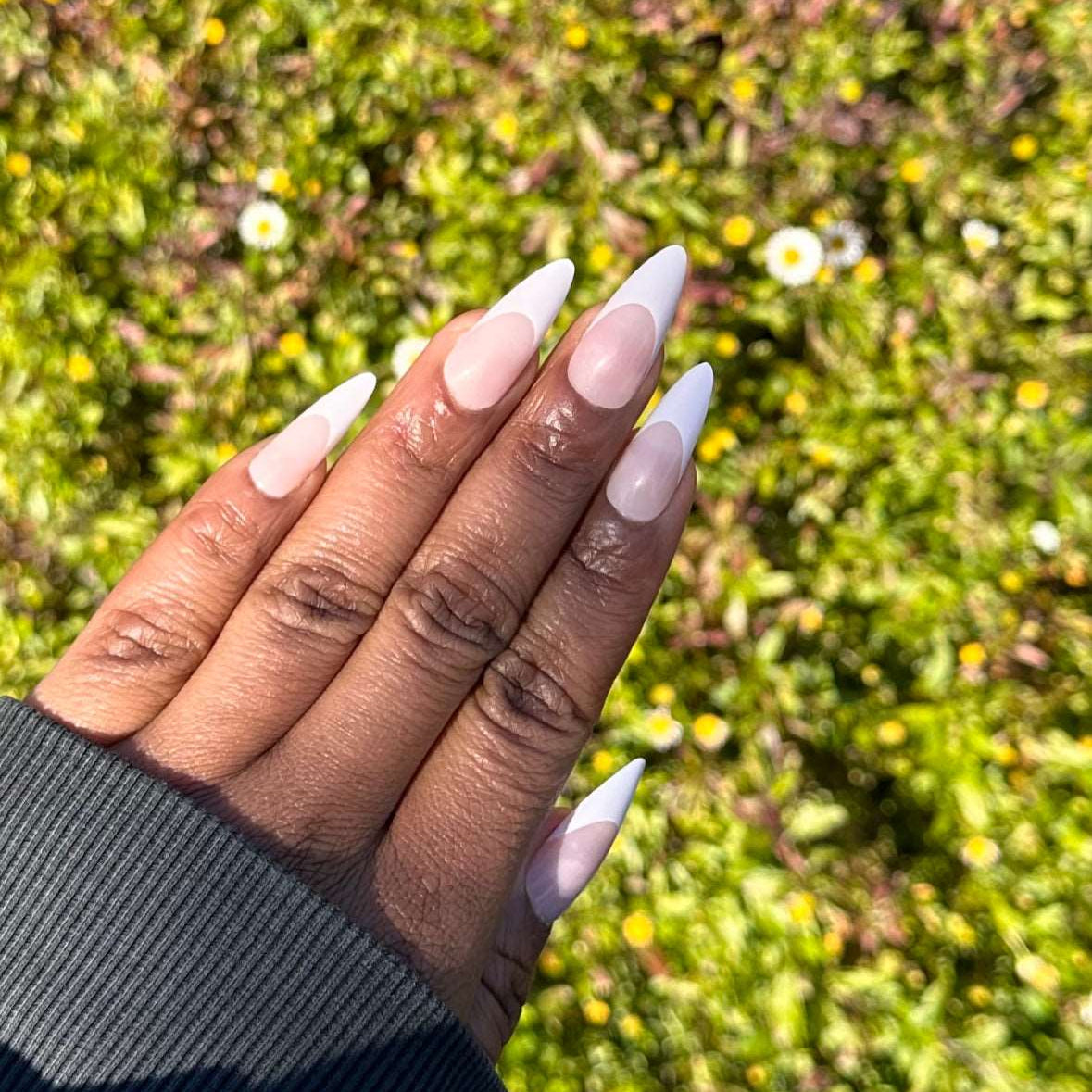 French tips press-on nails in natural light
