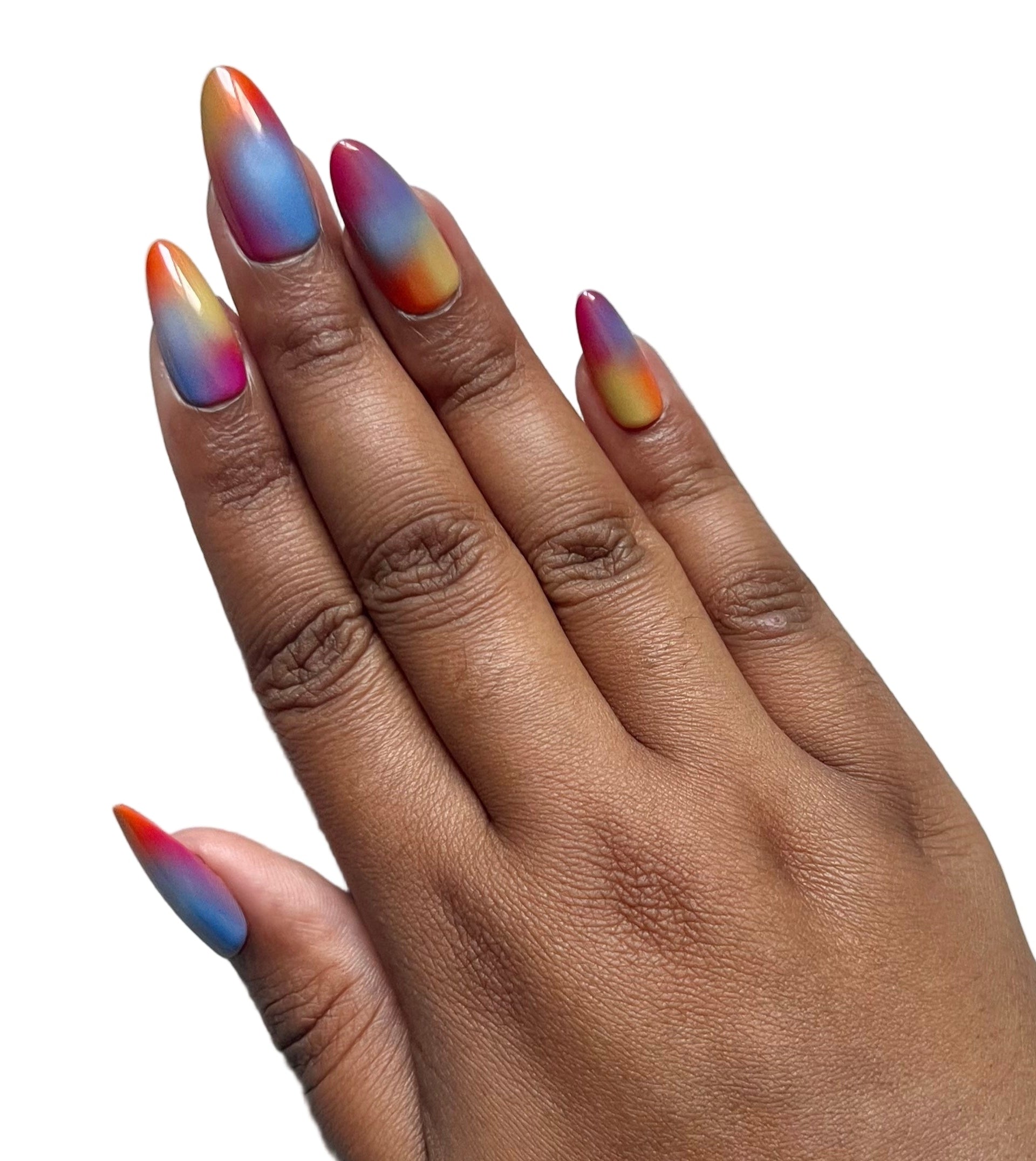Hand with multicolored press-on nails on a gray background