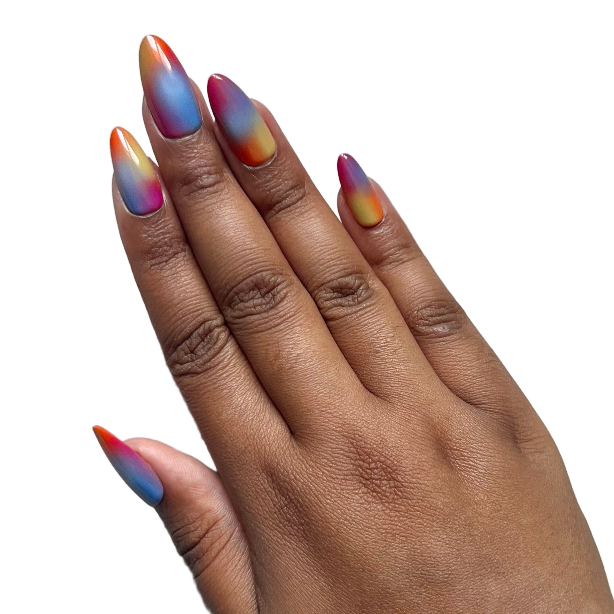 Hand with multicolored press-on nails on a gray background