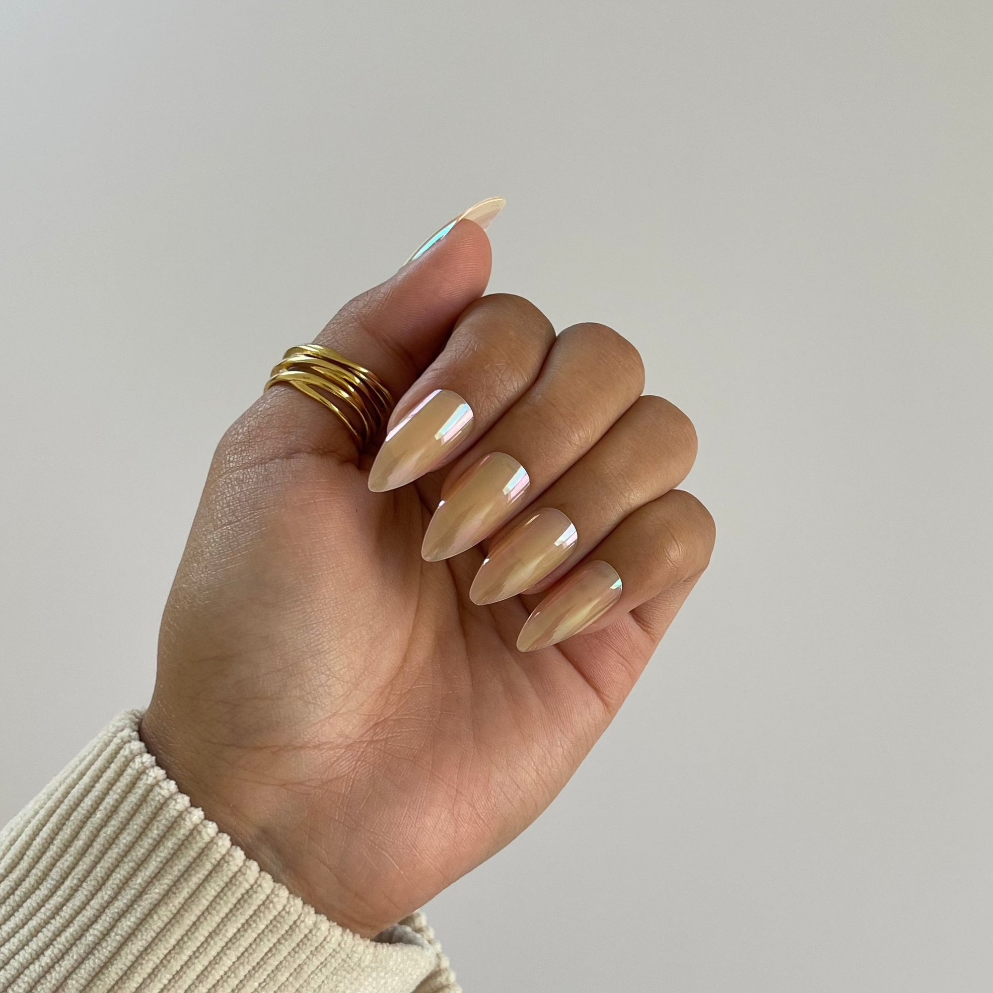 Aurora press-on nails with chrome finish on hand