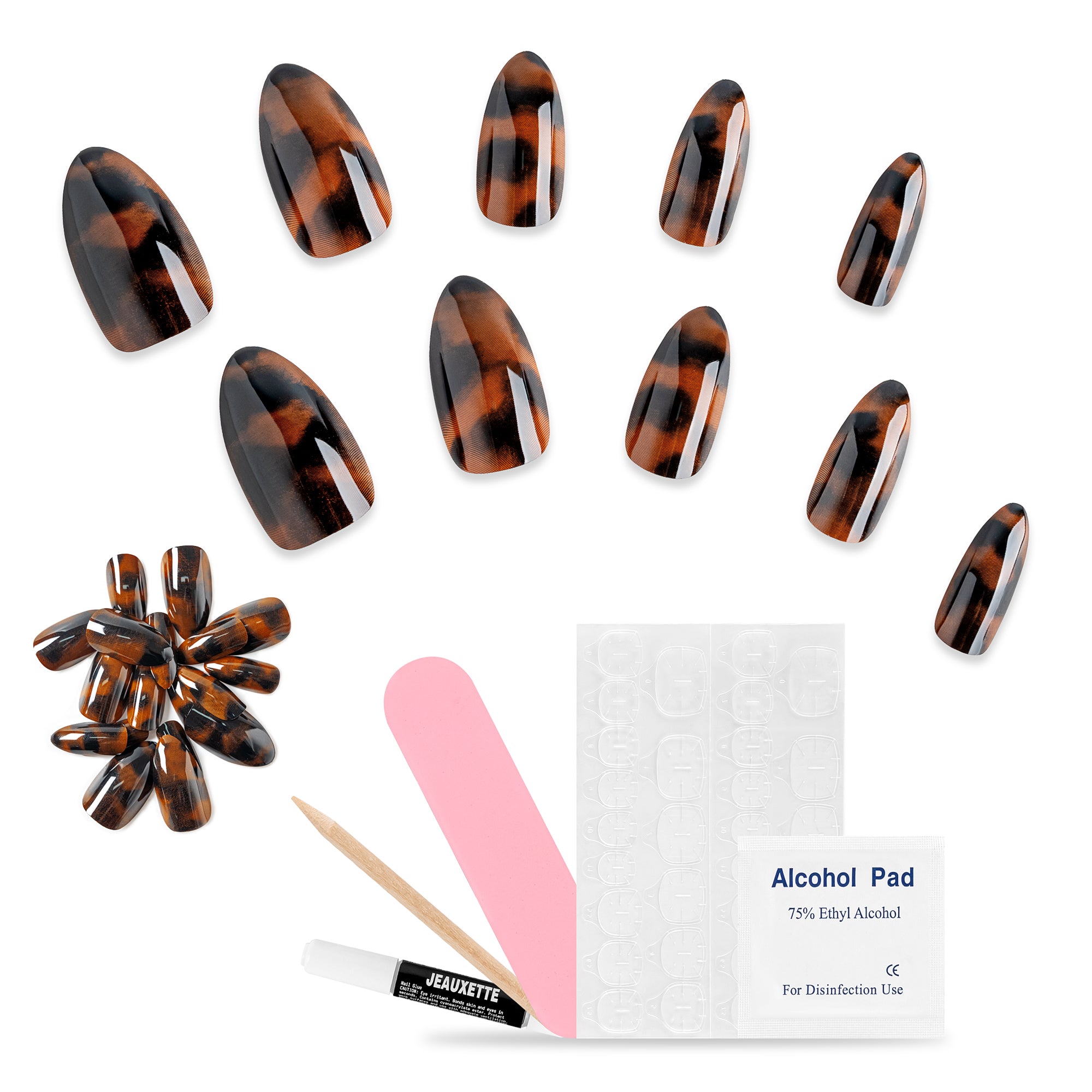 Set of tortoiseshell press-on nails with tools and alcohol pad on a white background