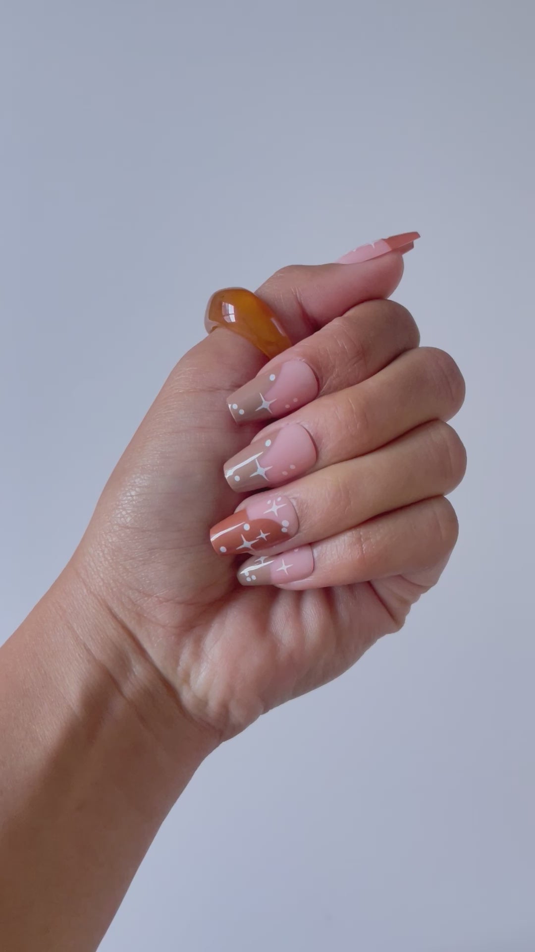 Stylish Hazel ombre press-on nails featuring star pattern.