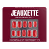 Jeauxette press-on nails kit packaging with red nails displayed on a white background